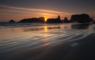 Bandon oregon beach, sunflare at sunset