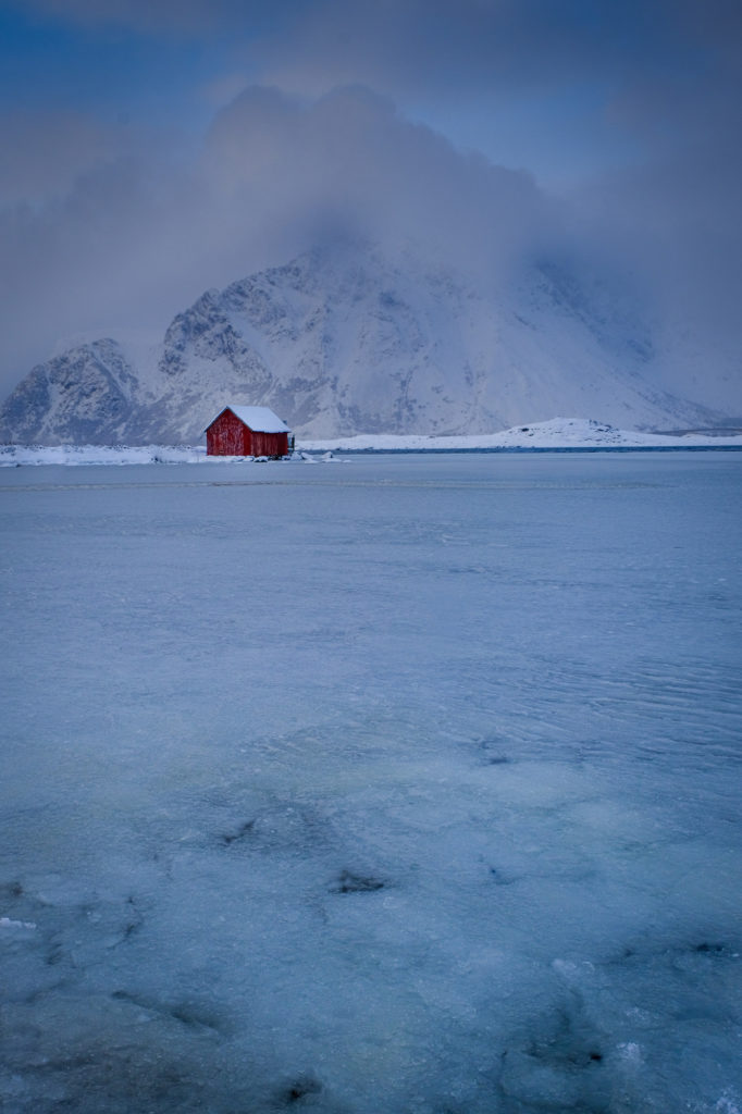 Red Cabin with mountain backdrop Norway