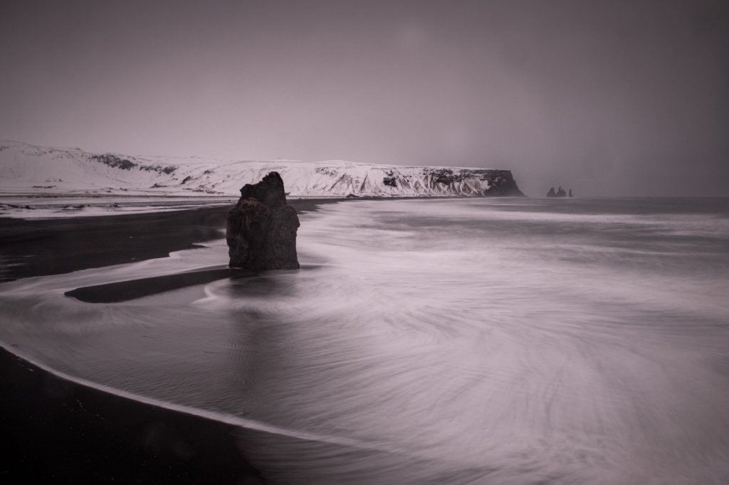 Ocean beach and sea stack near Vik Iceland