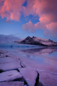 Sunset over lagoon with ice in Iceland