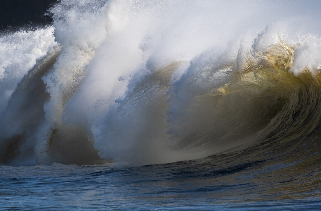 Waves in the ocean creating unique abstract shapes