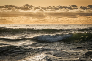 Waves in the ocean and cool clouds in the sky