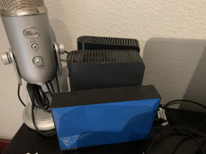 Collection of external hard drives on desktop