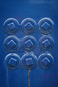 9 circles covered in blue paint