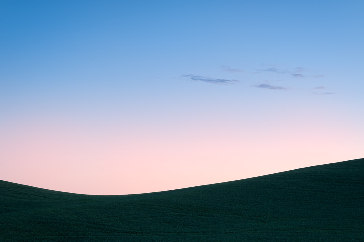 Photograph of sunrise over wheat fields in Palouse Washington