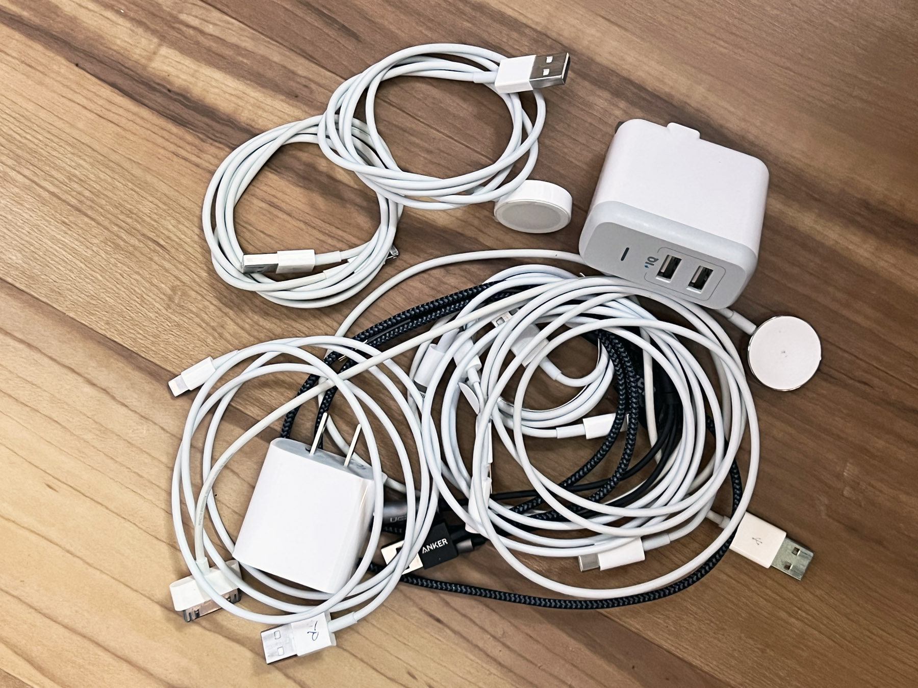 Tangle of charging cords for portable electronics