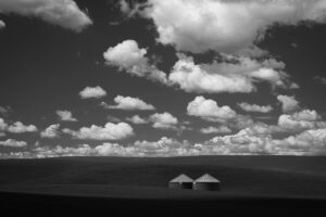 Two silos in the Palouse under cloudy skies